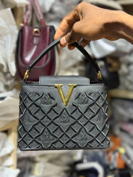 Valentino CharmVault – Luxe Mini Crossbody with Iconic Structure